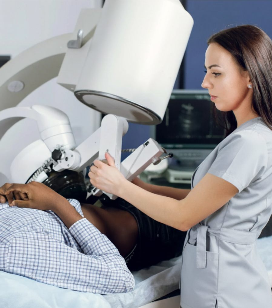 A physician performing a shockwave lithotripsy procedure to break up kidney stones