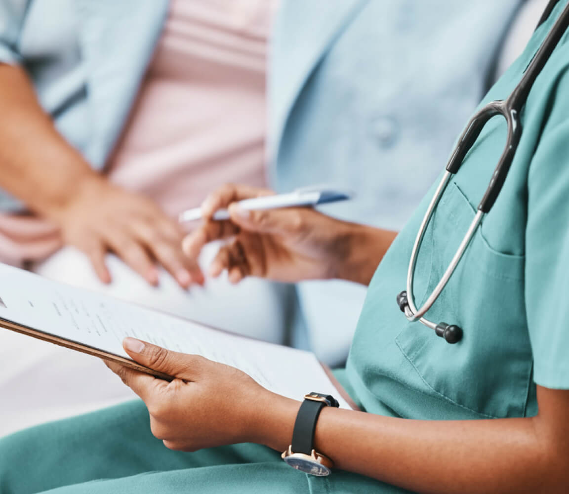 A physician consults with a patient before a CVAC System kidney stone treatment