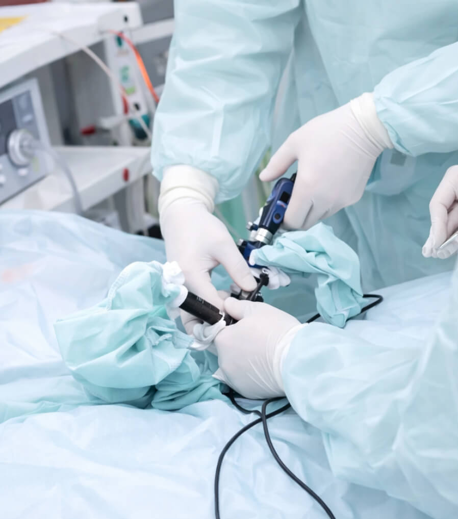 A physician performing a ureteroscopy procedure to clear kidney stones